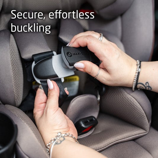 MAXI COSI Andi 360 rotating convertible car seat in gray being buckled in a car.