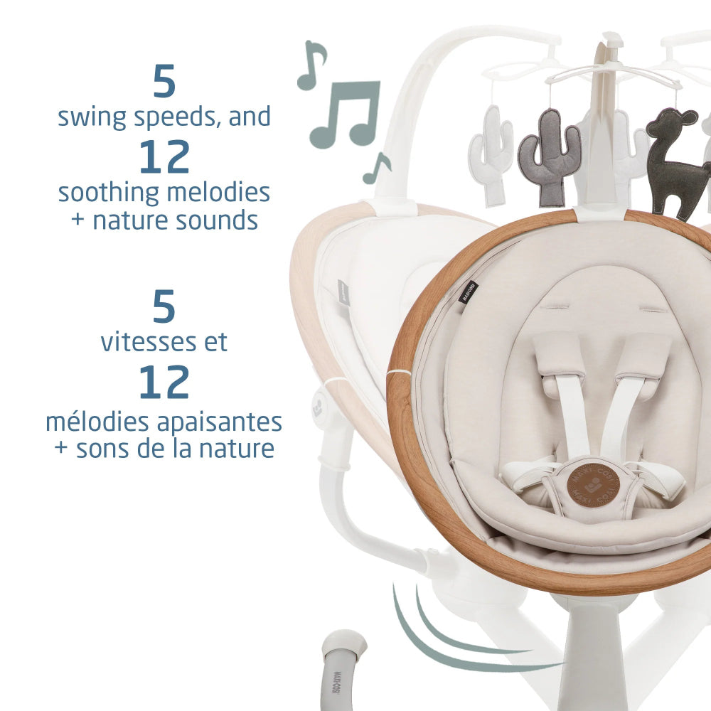 Maxi-Cosi Cassia Swing in white with wood trim; baby seat sways as 5 speeds and 12 soothing melodies play.