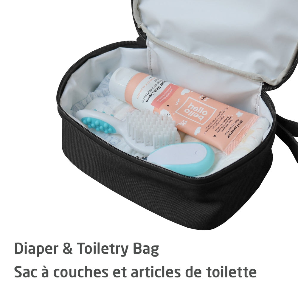 Maxi Cosi Changing Backpack, opened to reveal diapers, brush, and toiletries.