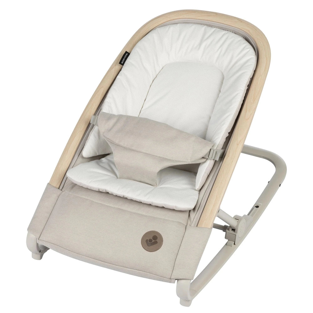 Maxi-Cosi Kori Rocker with natural wood frame and soft beige cushion