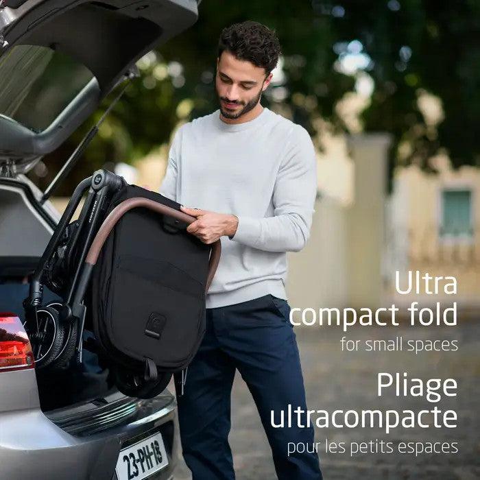 Maxi Cosi Leona ultra-compact stroller with compact fold loaded into a car trunk