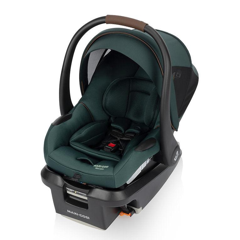 Maxi-Cosi Mico Luxe+ infant car seat in dark green with base and curved carrying handle.