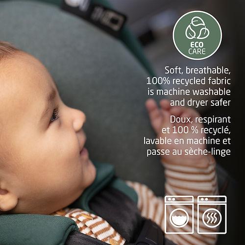 MAXI COSI Mico Luxe+ infant car seat in teal with soft, recycled fabric; baby seated and smiling.