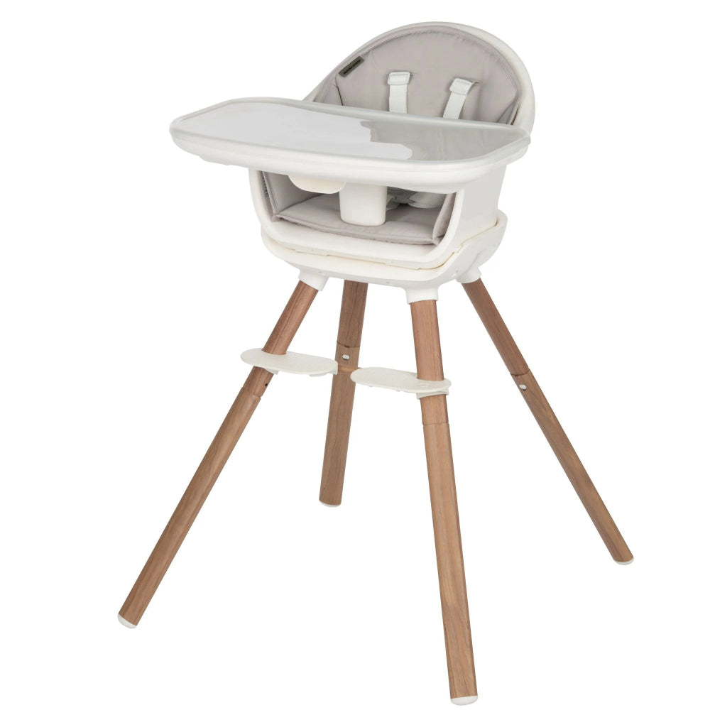 Maxi-Cosi Moa 8-in-1 high chair with white tray, gray seat, and natural wood legs