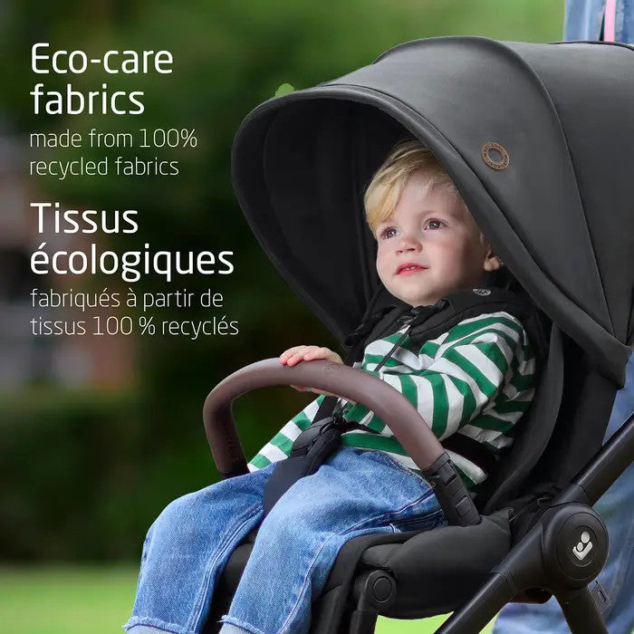 Maxi-Cosi Oxford stroller with eco-care fabrics; toddler seated in striped shirt in stroller