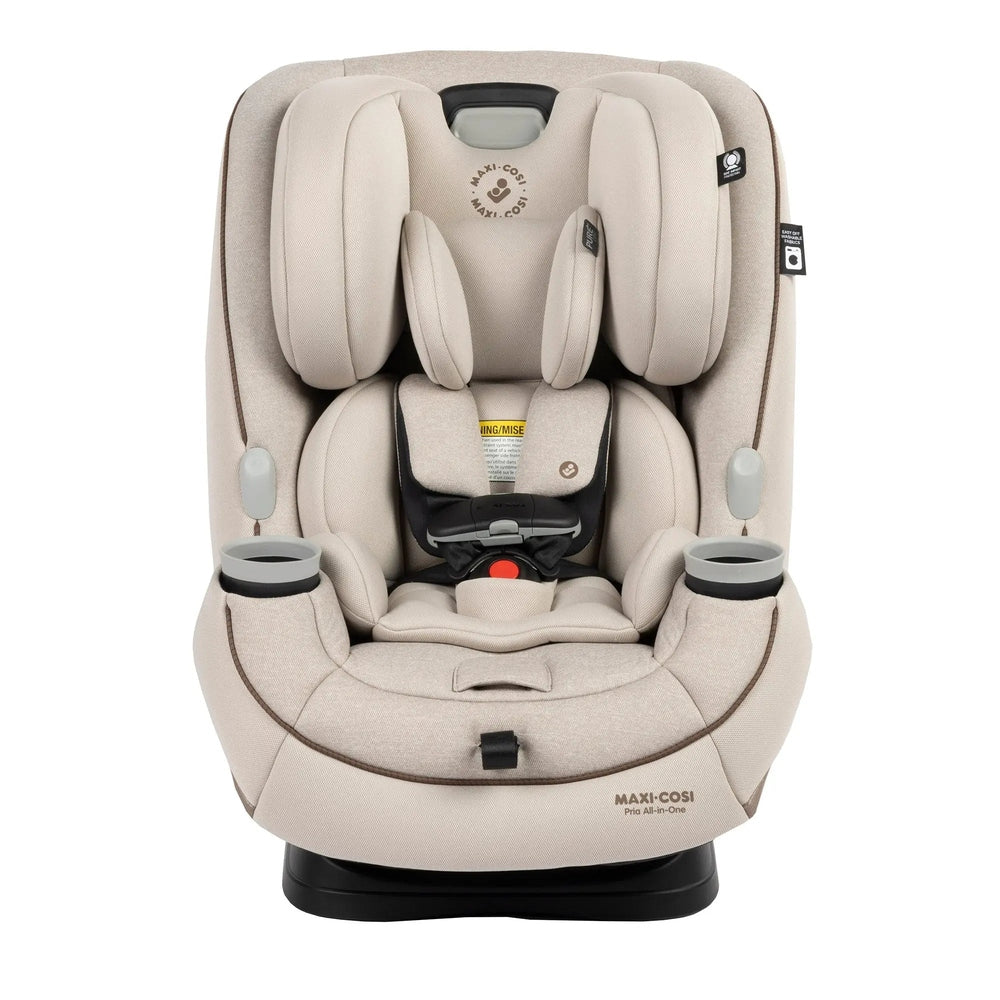 MAXI COSI Pria All-In-One Convertible Car Seat in beige with built-in cup holders and buckled 5-point harness.