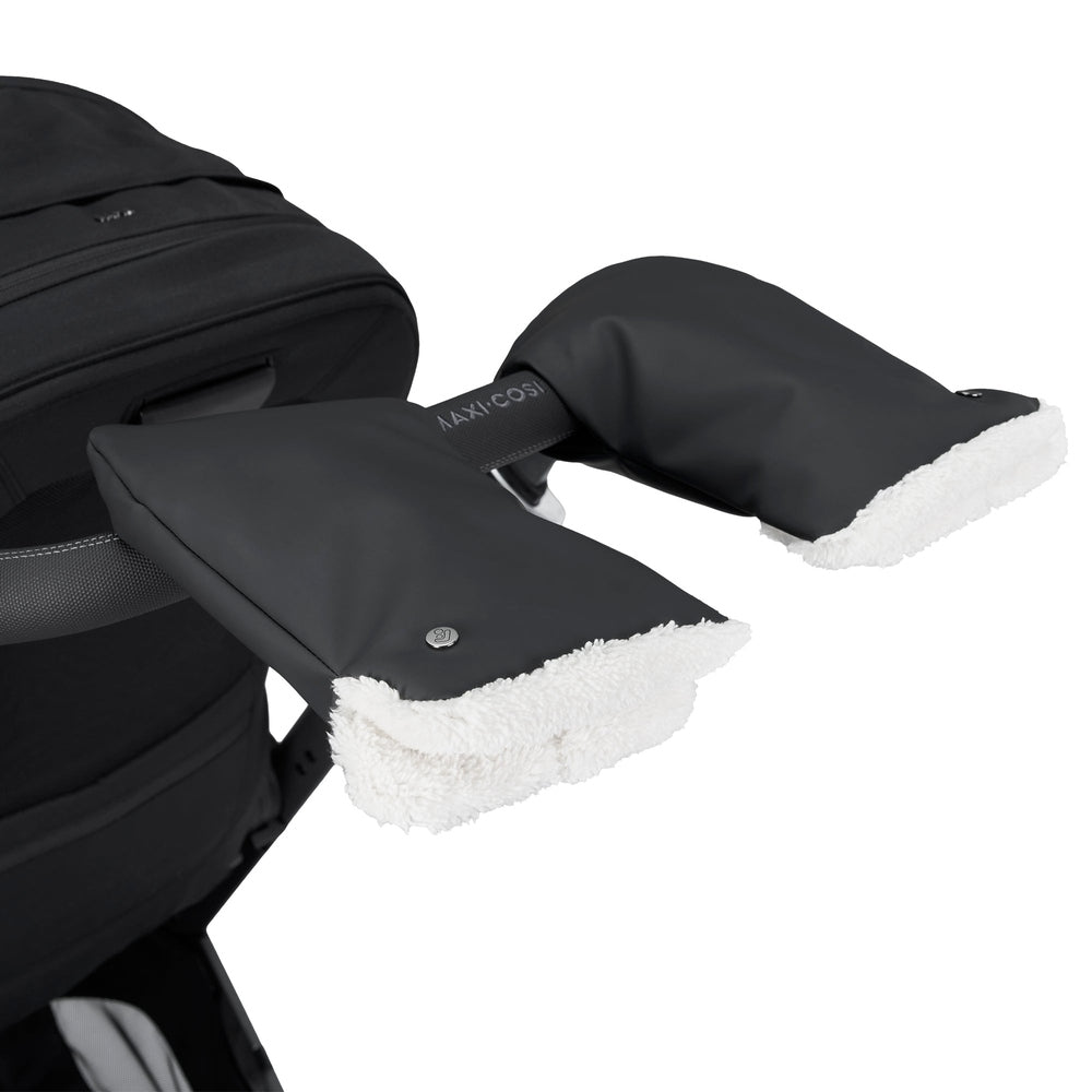 MAXI COSI Stroller Gloves in black with white fleece lining, attached to a black stroller.