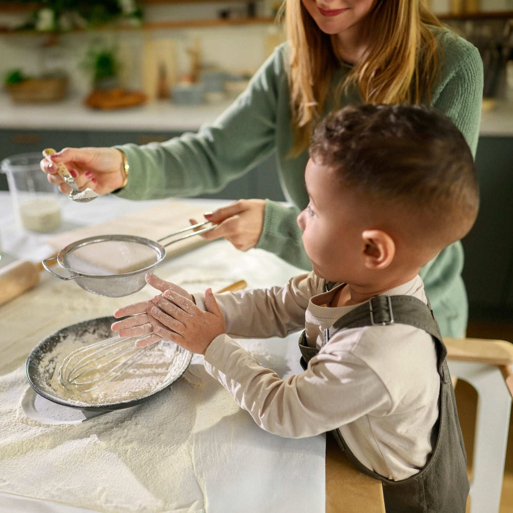 Maxi Cosi Toucan 3-in-1 learning tower for toddlers at the kitchen counter