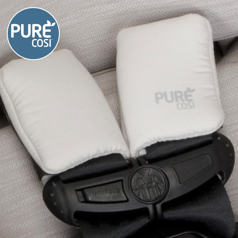 Maxi-Cosi Zelia Luxe 5‑in‑1 travel system harness with white padded straps clipped together