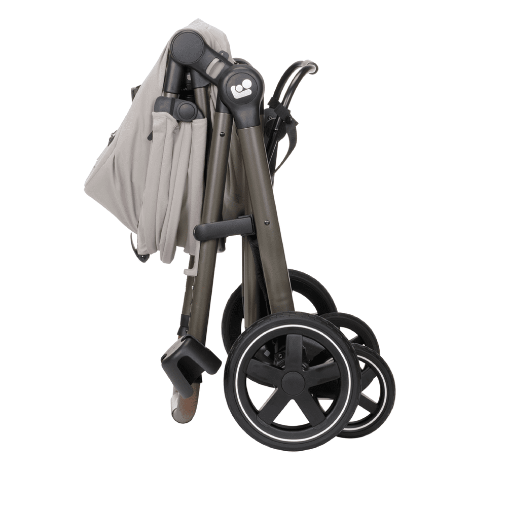 Maxi-Cosi Zelia Luxe 5-In-1 Modular Travel System stroller folded with beige fabric and large wheels.