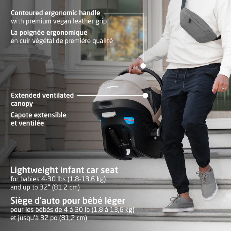 Maxi-Cosi Zelia Luxe 5-in-1 modular travel system; adult carries infant car seat by its contoured ergonomic handle.