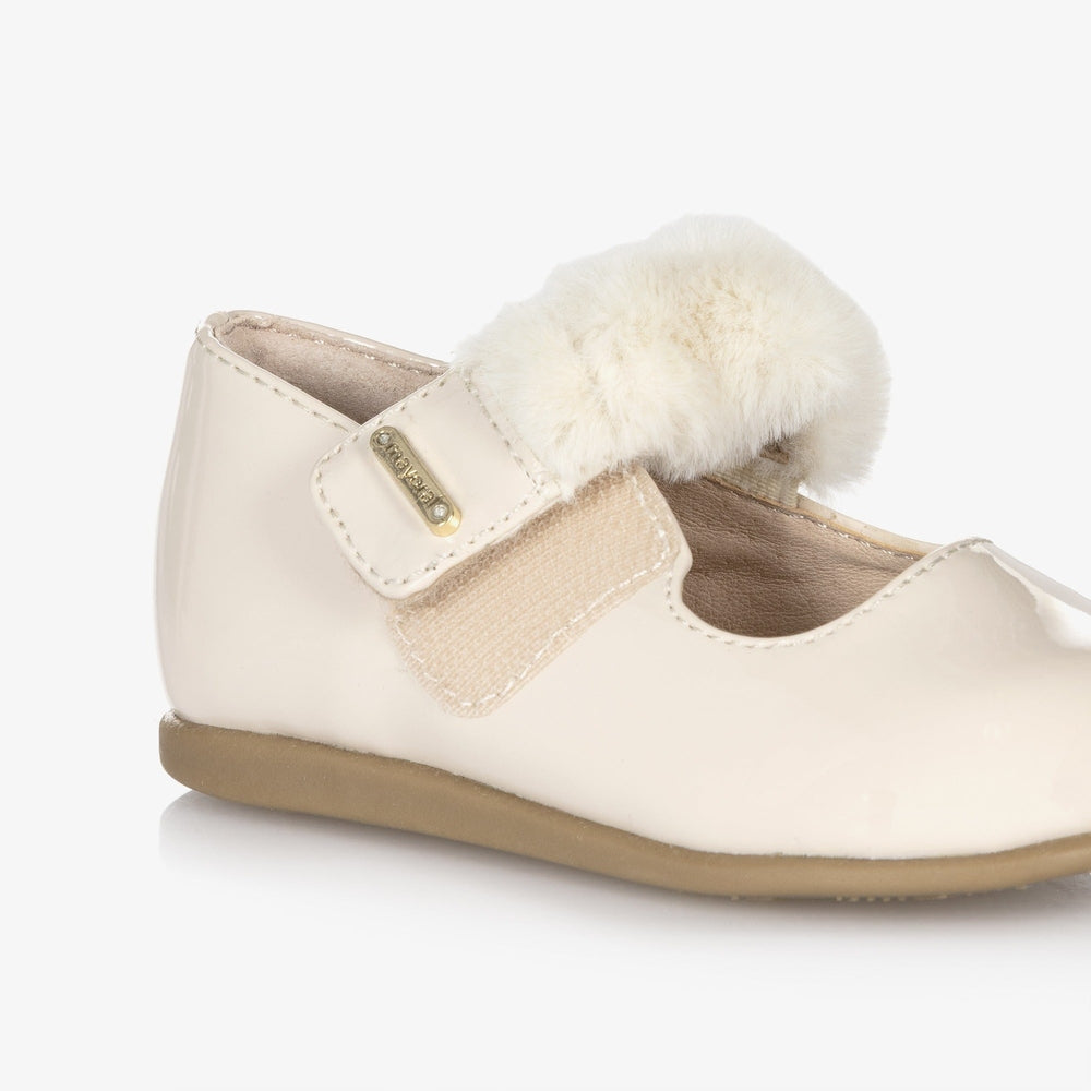 Mayoral Girl Patent Leather Mary Janes with cream patent finish, fluffy fur strap and Velcro closure.