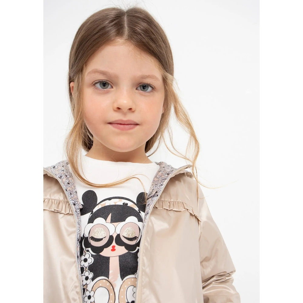 MAYORAL girl reversible windbreaker jacket almond worn by a young girl, beige shell with floral lining visible.