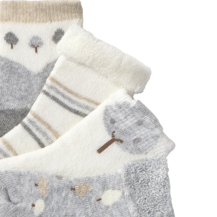 Mayoral newborn 4-pack socks in cream, gray, and white with tree, stripe, and bear motifs.