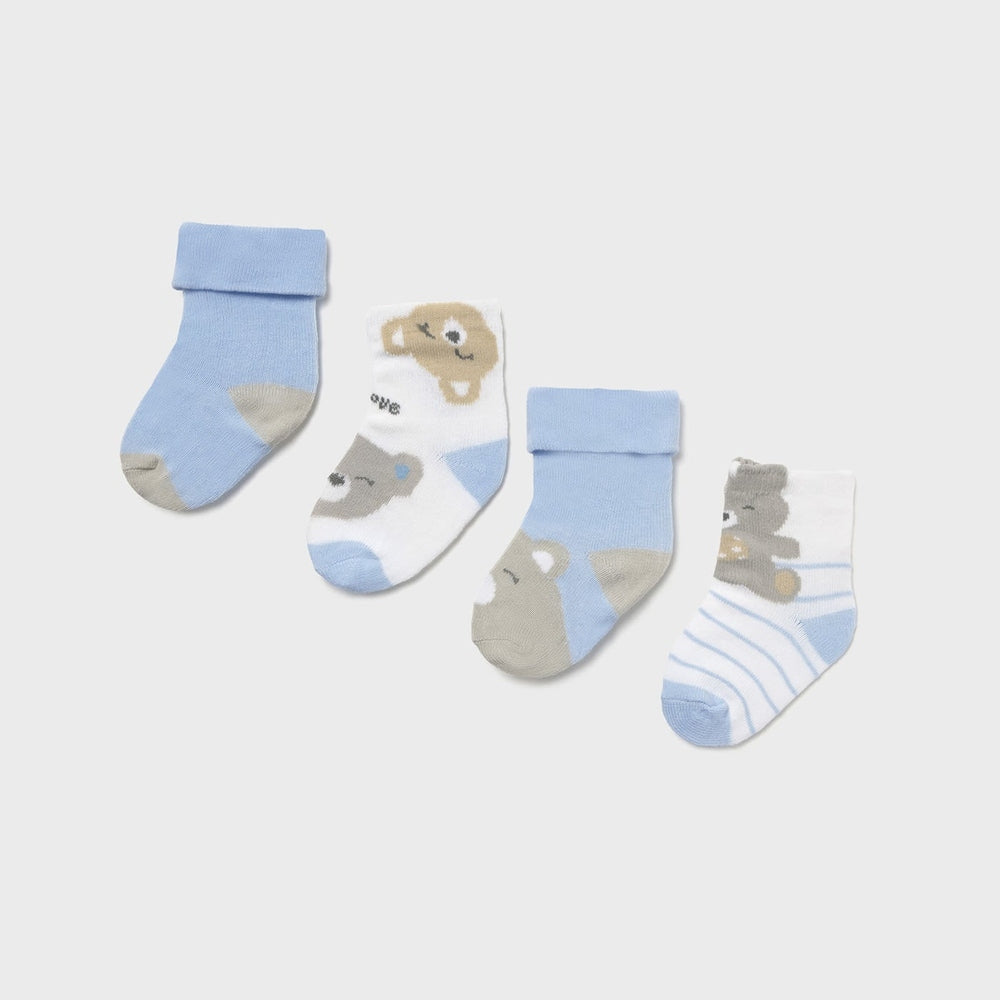 Mayoral Newborn 4-Pack Socks Sky: four sky-blue baby socks with bear motifs laid flat to show pattern variety.