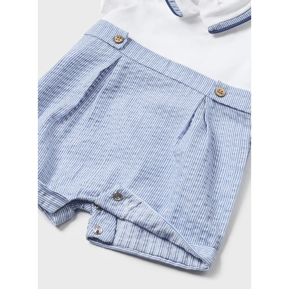 Mayoral Newborn Romper With Hat Seersucker in blue-white stripes, showing leg snaps and wooden shoulder buttons.