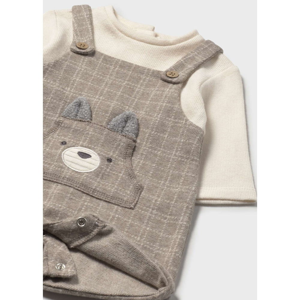 MAYORAL Short Soft Dungaree Sesame laid over cream knit top, bear-face pocket and button straps.