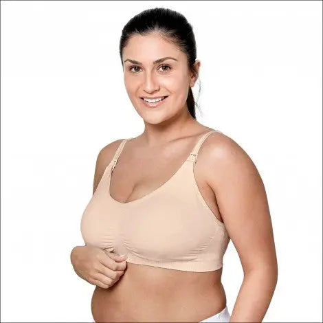 Medela 3 In 1 Nursing Bra Chai nude, seamless maternity nursing bra, model lifts cup for easy nursing access.