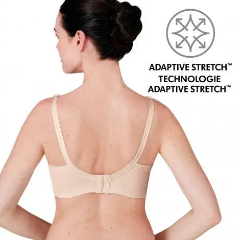 Medela 3 In 1 Nursing Bra Chai beige worn by a woman, back clasp visible, illustrating adaptive stretch fit.