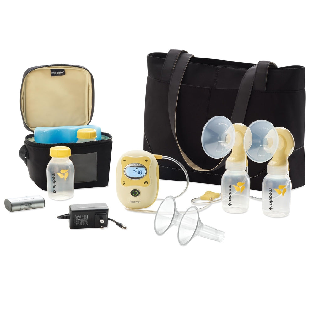 Medela Freestyle double electric breast pump kit with tote bag, cooler, bottles, and accessories