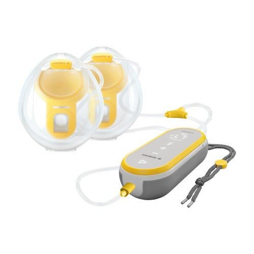 Medela Freestyle hands-free double electric breast pump with two yellow shields and gray control unit