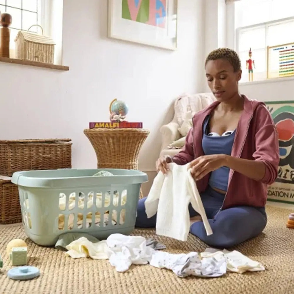 Medela Melody InBra Double Electric Breast Pump hands-free pumping concept in a bright, cozy room.