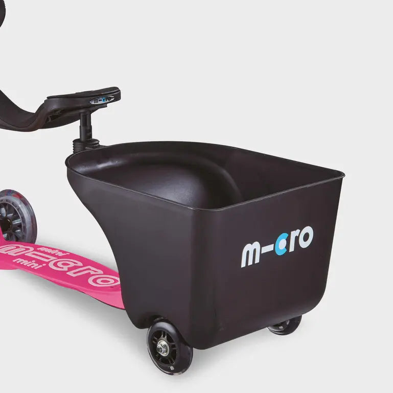 Micro Balance Bike Trailer attached to a pink balance bike, black cargo tub with MICRO branding, ready for ride