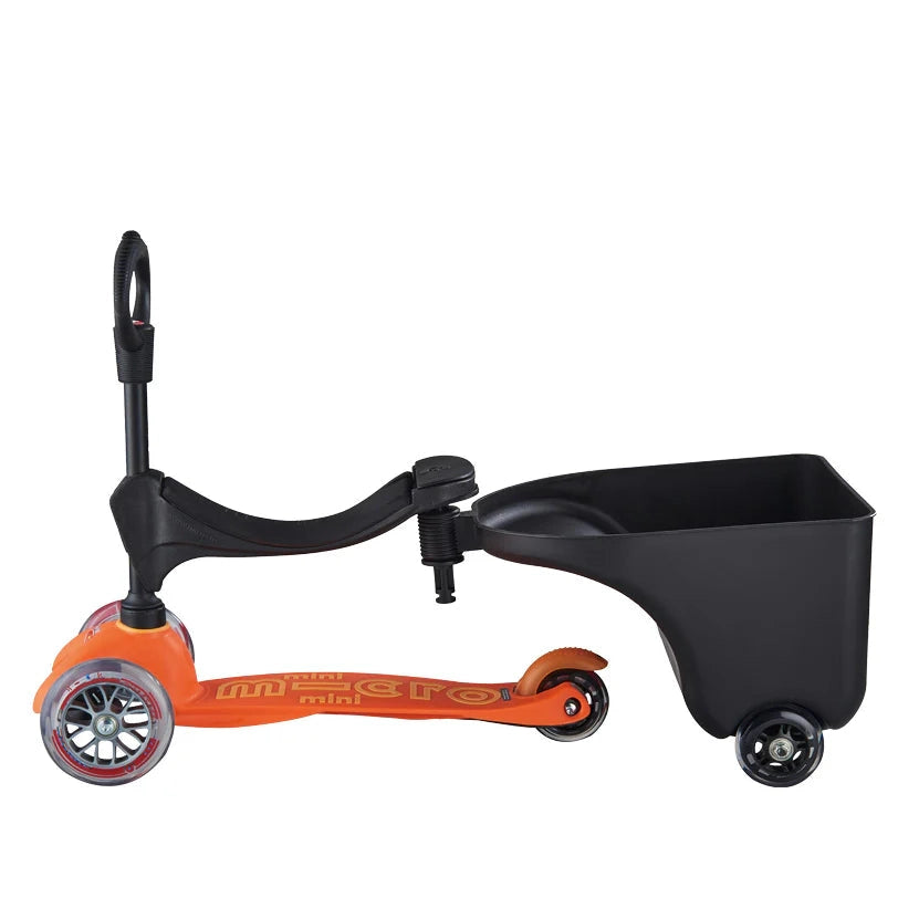 Micro Balance Bike Trailer with orange frame and black cargo cart, wheels attached for preschooler rides.
