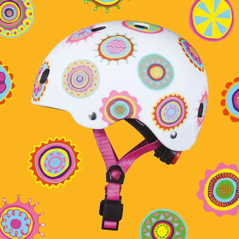 Micro Helmet V2 Doodle Dot white safety helmet with colorful circular doodles, pink chin strap fastened under the chin.