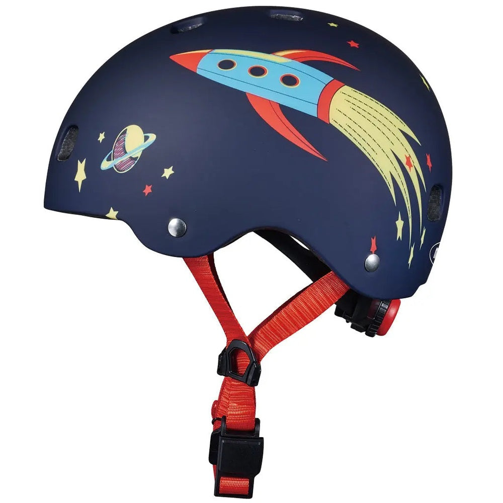 Micro Helmet V2 Rocket navy kids helmet with red chin strap buckled on; rocket artwork.