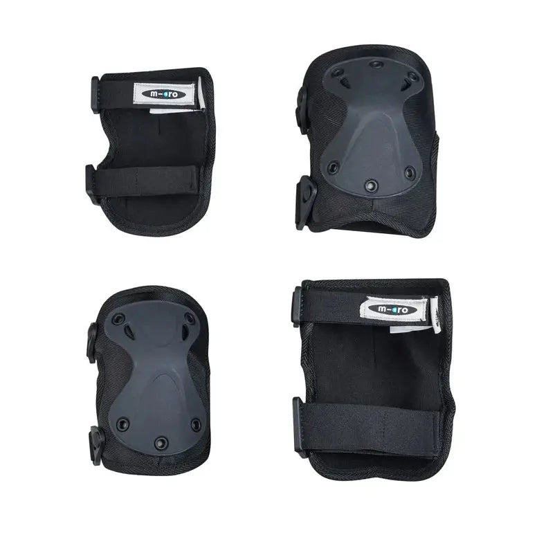 Micro Knee & Elbow Pad Set Black, four-piece protective pads with hard shells and adjustable Velcro straps.