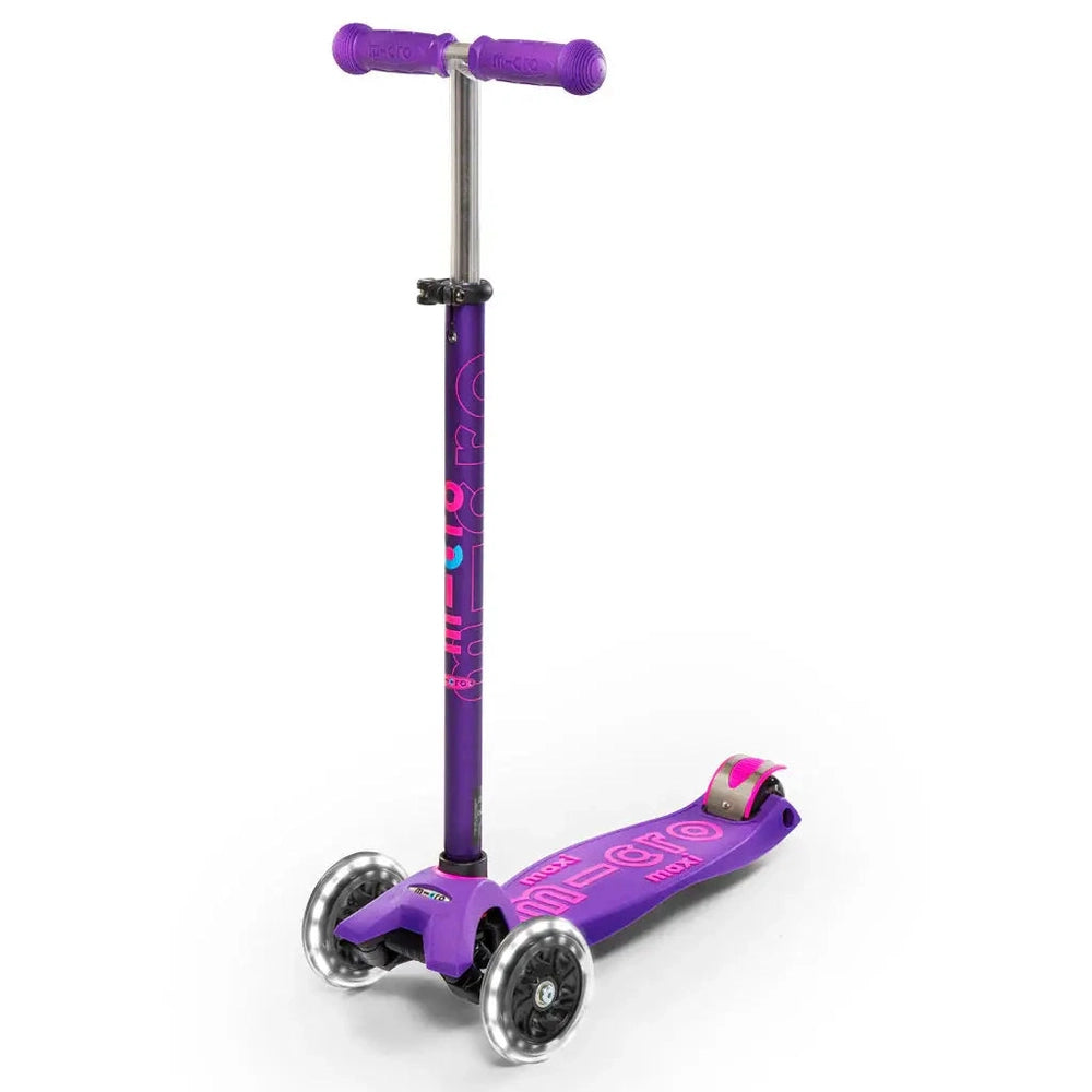 Micro Maxi Deluxe LED Scooter in purple with pink graphics and three wheels, ready to ride.
