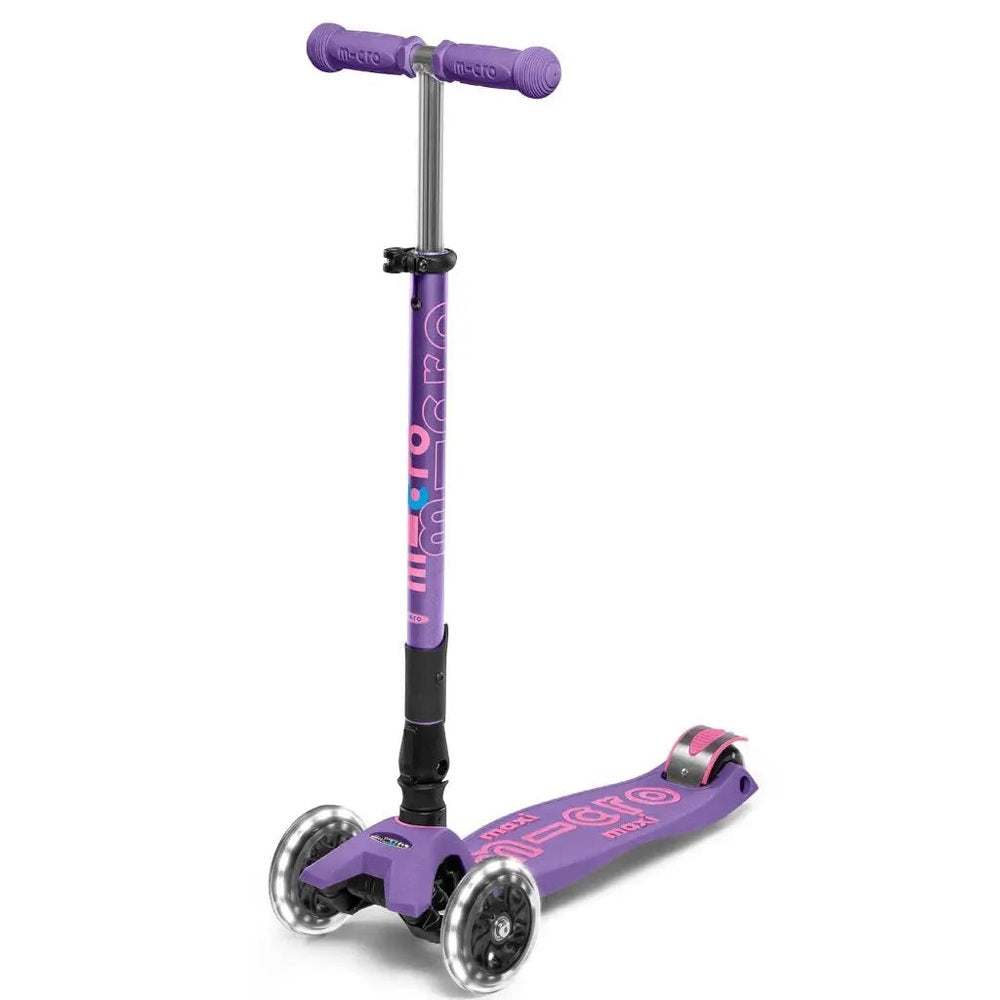Micro Maxi Foldable Deluxe LED Scooter in purple three-wheel design, standing upright with deck graphics.
