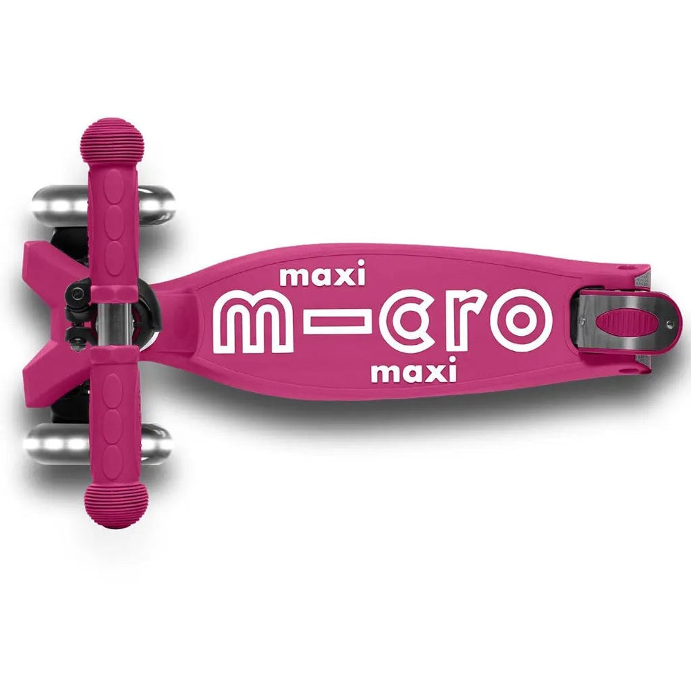 Micro Maxi Foldable Deluxe LED Scooter in pink, kid-sized deck with maxi branding and foldable latch