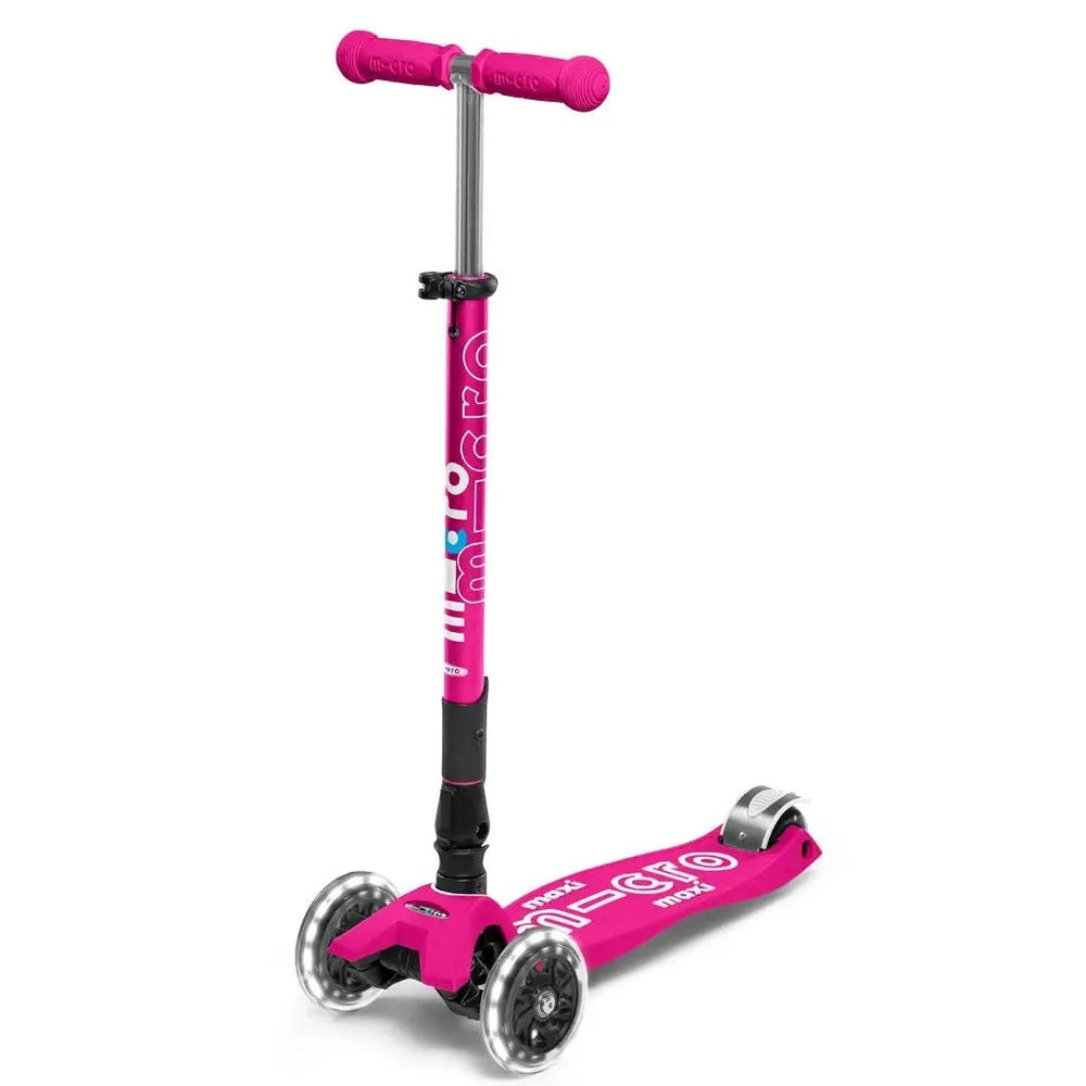 Micro Maxi Foldable Deluxe LED Scooter pink, standing with adjustable handlebar and three wheels.