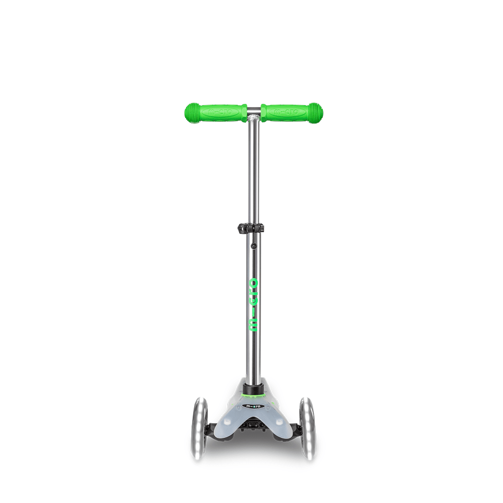 Micro Mini Deluxe Flux LED scooter with green grips and silver frame, 3-wheel design
