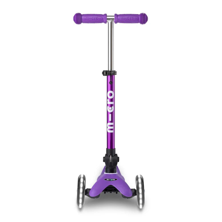 Micro Mini Deluxe Foldable LED Scooter, purple with three wheels and adjustable handlebars for stability.