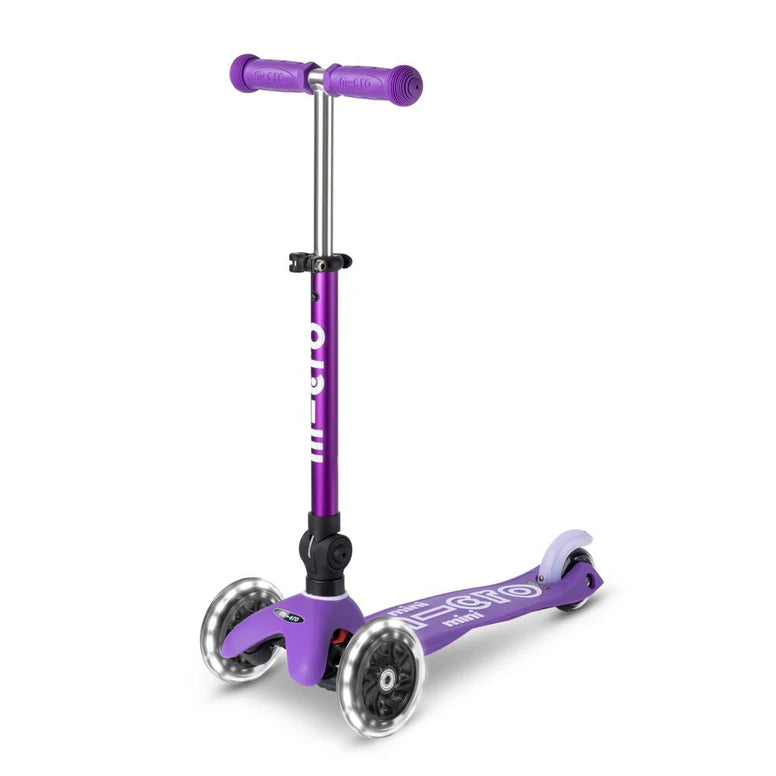 Micro Mini Deluxe Foldable LED Scooter for kids, purple three-wheel scooter with extended T-bar.