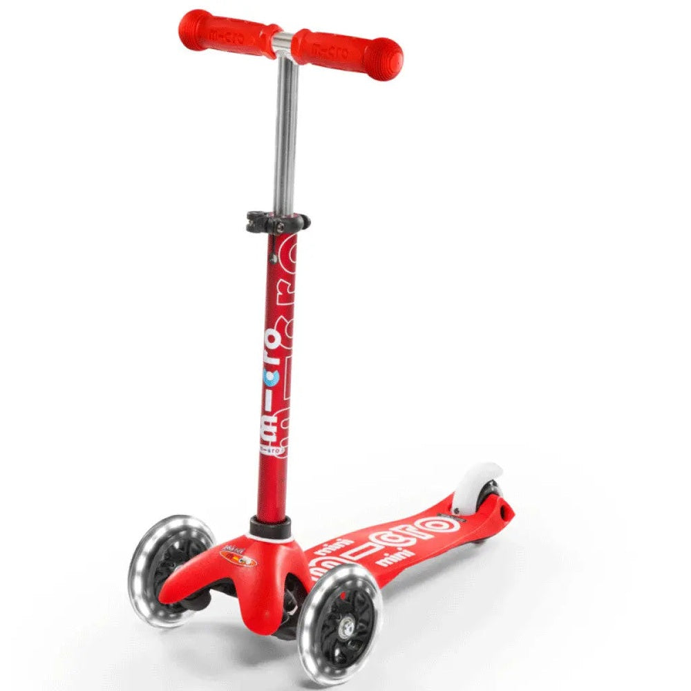 Micro Mini Deluxe LED Scooter red three-wheel kids scooter with MICRO branding, upright handlebar and deck on a white backdrop.