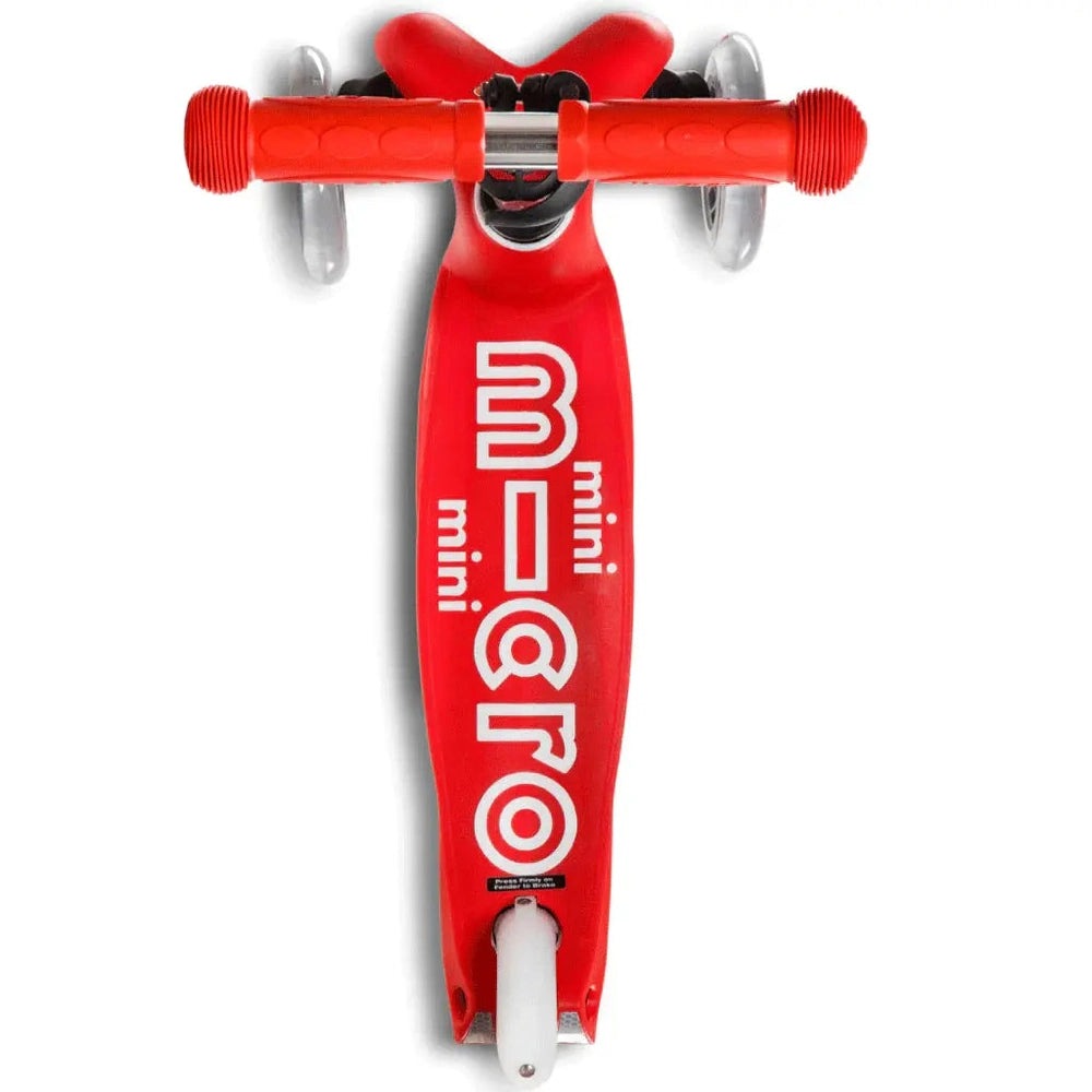 Micro Mini Deluxe Scooter, red deck with white wheels, sturdy red handlebars shown ready to ride.