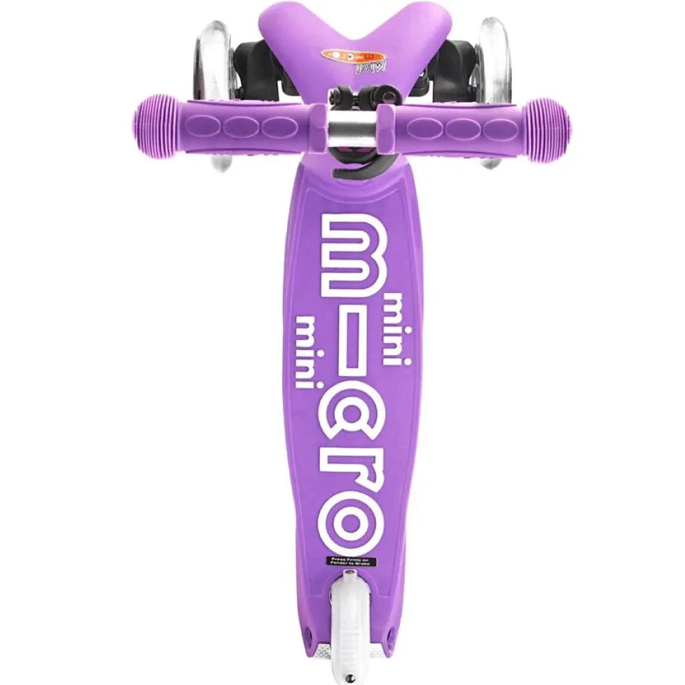Micro Mini Deluxe Scooter front view with purple deck, white MICRO branding, and purple grip handles.