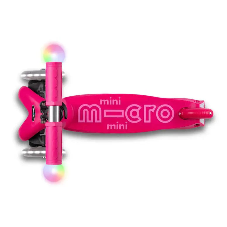Micro Mini2Grow Deluxe LED scooter in pink with light-up rainbow wheels that illuminate as you ride