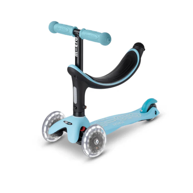 Micro Mini2Grow scooter with blue deck, turquoise grips, three wheels, MICRO brand.