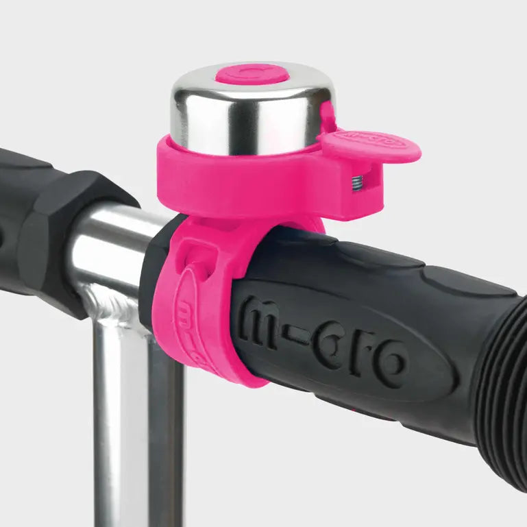 Micro scooter bell pink mounted on black handlebar grip with a silver top MICRO brand