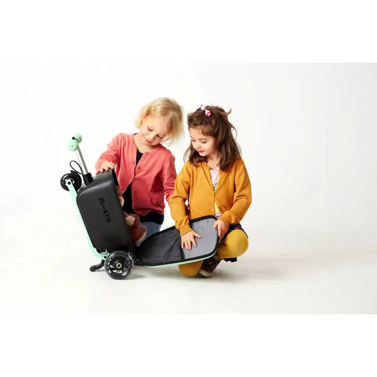 Micro Scooter Junior Luggage Mint, mint-colored kids’ scooter-luggage combo used by two children.
