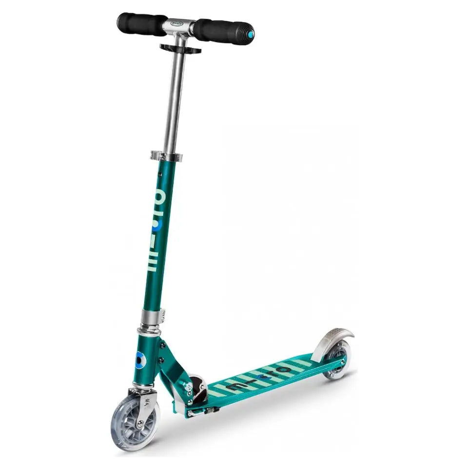 Micro Sprite scooter in teal with chrome stem and black grip handlebars, front wheel turned as it stands ready to ride.
