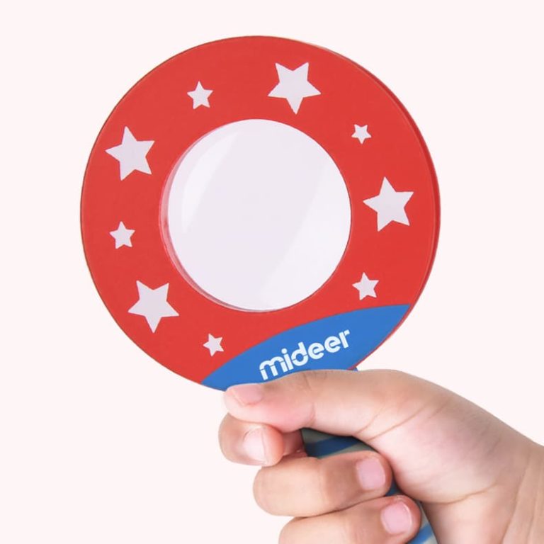 Mideer Detective In Room Puzzle red circular magnifier toy with white stars, held by hand