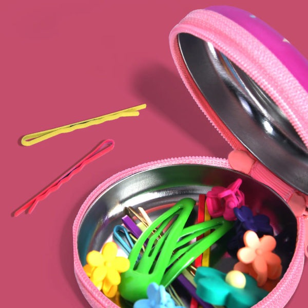 MIDEER tin purse Lovely Girl; pink metal coin purse opened to reveal colorful hairpins and flower clips inside