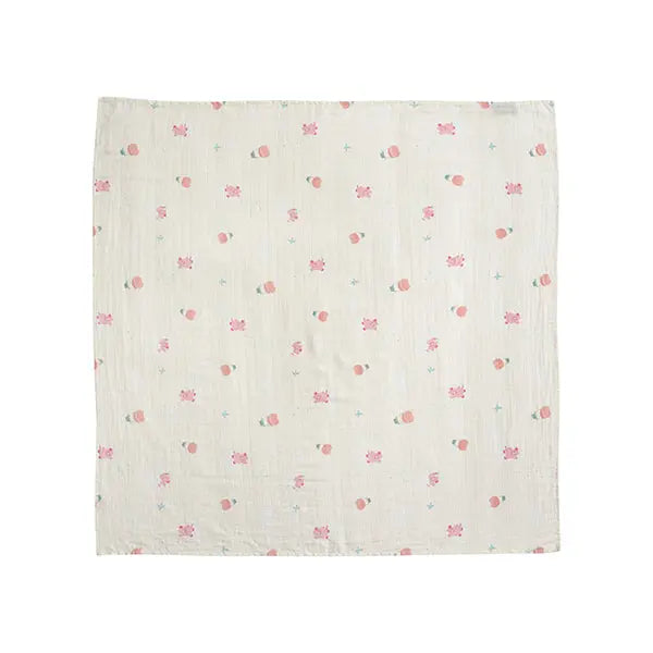 MILO & GABBY Bamboo Blanket, white with pink floral motifs, laid flat to showcase soft, breathable baby bedding