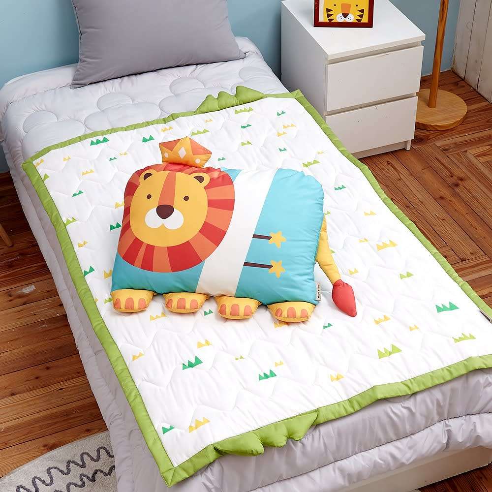 MILO & GABBY kids pillowcase with a colorful lion graphic on white quilted bedding